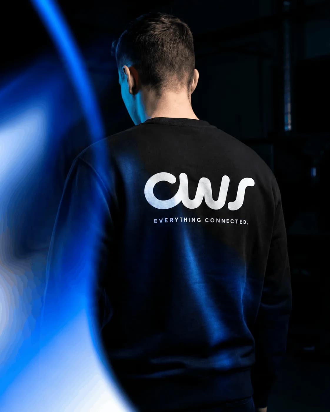 CWS Agency identity on black team apparel